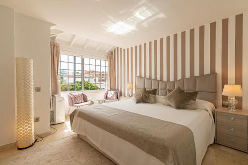 A bed or beds in a room at Apartment Terrazas La Caleta, Costa Adeje
