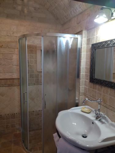 a bathroom with a shower and a sink at IL TRULLO GENTILE ALBEROBELLO in Alberobello