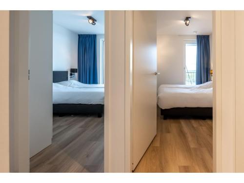 Ένα ή περισσότερα κρεβάτια σε δωμάτιο στο Loft in Zeeland by Marina and Veerse Meer