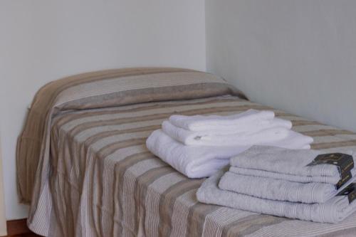 En eller flere senge i et værelse på Casa D'artista - charming apartment + Parking