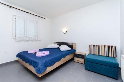 Ένα ή περισσότερα κρεβάτια σε δωμάτιο στο Apartments Mirko R