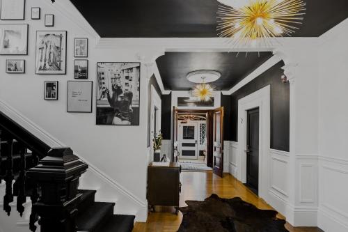 a hallway with white walls and a black ceiling at The Coach House in Salem