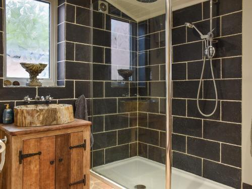 a bathroom with a shower and a sink at Pippin Cottage in Bures Saint Mary