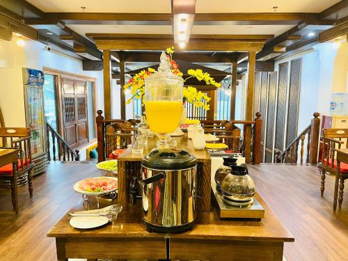 a blender sitting on a table with a drink in it at Veshia Hotel & Spa in Hanoi