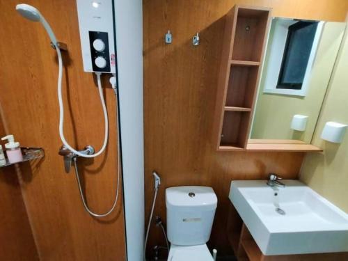 a bathroom with a shower and a toilet and a sink at SS CondoStay Residensi Lili, Nilai nearby KLIA, USIM - infinity pool, wifi, smart tv in Nilai