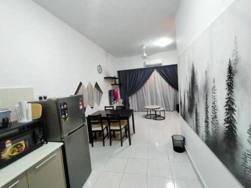 a kitchen with a refrigerator and a dining room at SS CondoStay Residensi Lili, Nilai nearby KLIA, USIM - infinity pool, wifi, smart tv in Nilai