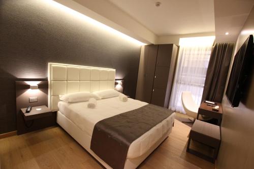Ένα ή περισσότερα κρεβάτια σε δωμάτιο στο Mokinba Hotels Baviera