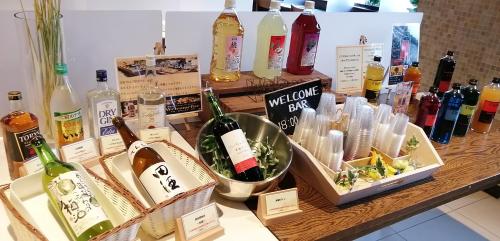 a bunch of bottles of wine on a table at Super Hotel Aomori in Aomori