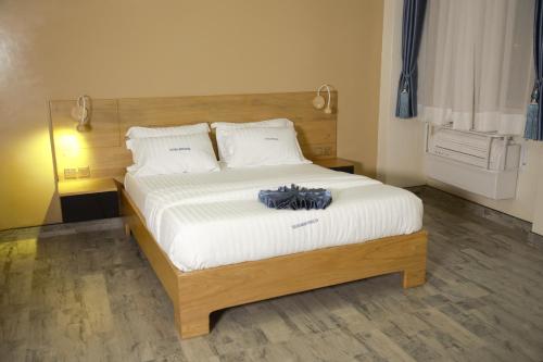 Кровать или кровати в номере Victoria Mews Hotel