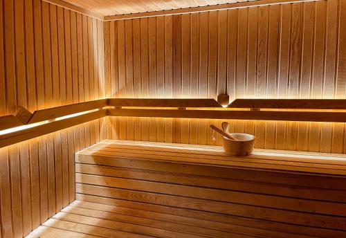 a sauna with a tub and a bucket in it at The Conforium Hotel Van in Van