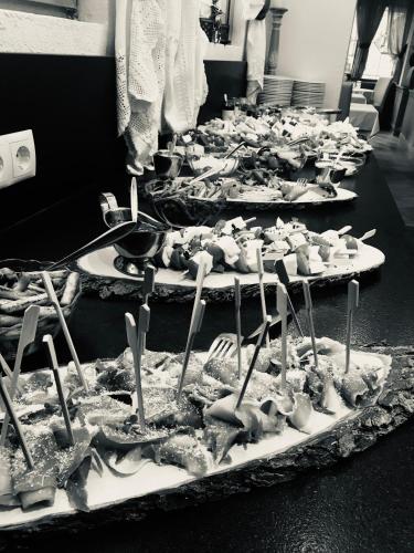 a row of trays of food on a table at Hotel Central in Ischgl