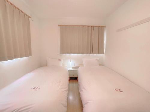 Un pat sau paturi într-o cameră la Fuji Sankando Villas sankando - Vacation STAY 56304v