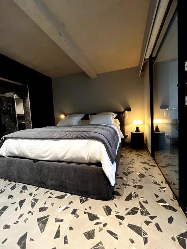 a bedroom with a large bed in a room at Suite 28 in Treilles