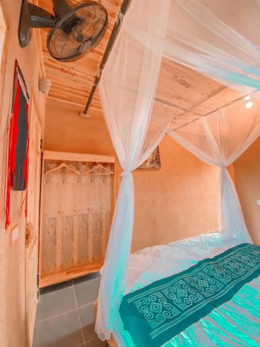 Postel nebo postele na pokoji v ubytování Dồn Dao Homestay