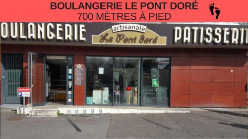 a store front of a store with a sign on it at L'atelier Chic - Wifi fibre - Parking privée - Balcon - NETFLIX in Lanester