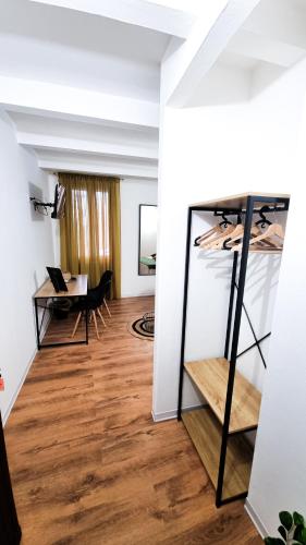 a room with white walls and a wooden floor at Ecorooms Ferrara in Ferrara