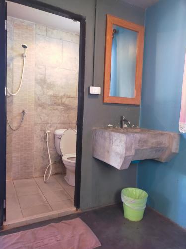 a bathroom with a sink and a shower and a toilet at 9 Hostel in Chiang Mai