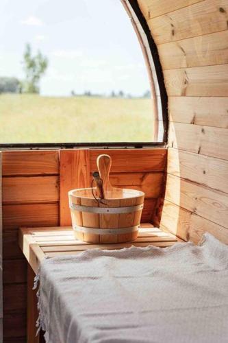 a bowl and a wooden spoon sitting on a window sill at ChienMarin Healthfarm & Residences Anno 1712 ***** in Nieuwpoort