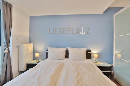 Katil atau katil-katil dalam bilik di Strandduene Stranddüne Appartement 23