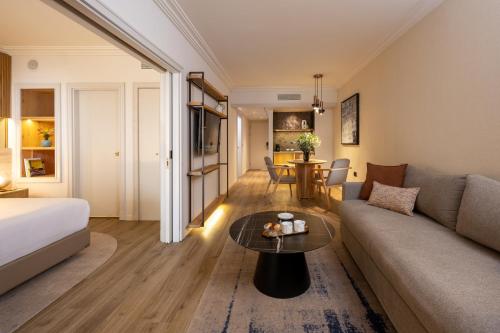a living room with a couch and a table at Aria in Eilat