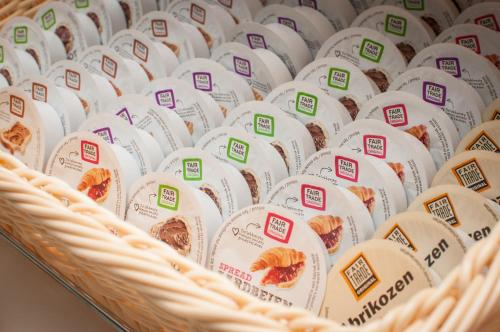 a basket filled with white packages of food at Hotel Fine Harmony in Amsterdam