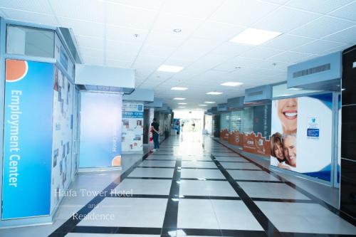 a hallway of a hospital with posters on the walls at Haifa Peak in Haifa