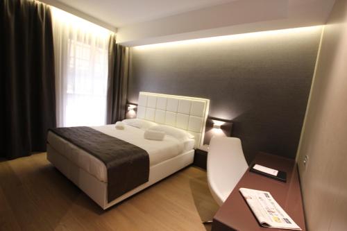 Ένα ή περισσότερα κρεβάτια σε δωμάτιο στο Mokinba Hotels Baviera