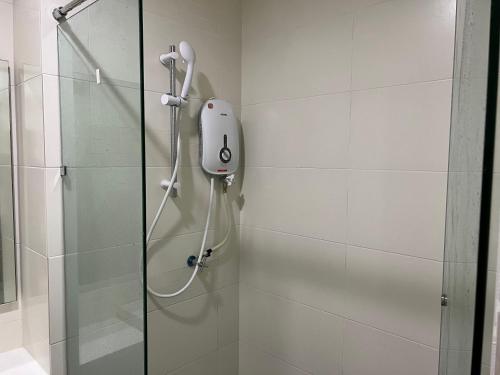 a shower with a shower head in a bathroom at BLUE JADE STUDIOS in Tanah Rata