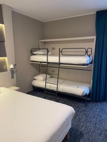 Ein Bett oder Betten in einem Zimmer der Unterkunft Ibis Styles Nivelles