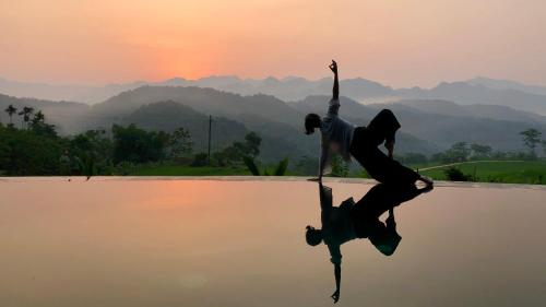 a person doing a trick on a skateboard in the water at Lua Pu Luong in Pu Luong