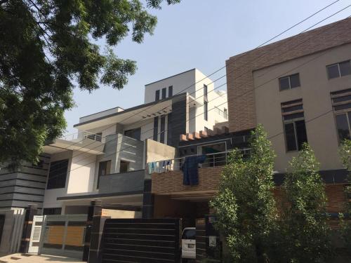 an image of a building on a street at Continental Girls Hostel UCP in Lahore