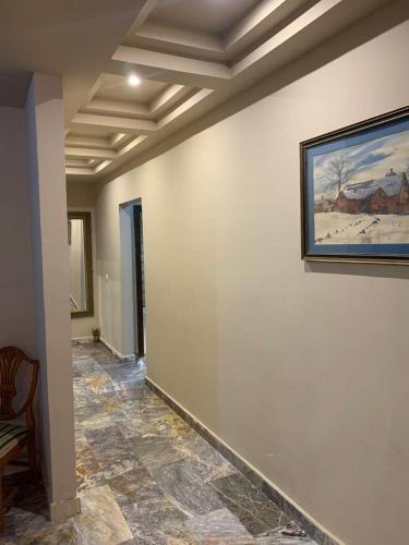 a hallway with a painting on the wall at فيلا 