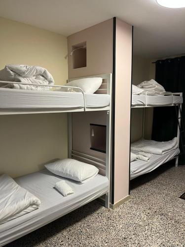 a room with three bunk beds in a room at Bethlehem City Hostel in Bethlehem