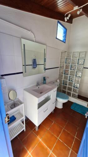 a bathroom with a sink and a toilet at Casa Marcos in La Gomera with relaxing terrace in Agulo