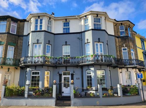a large house with balconies on a street at No 58 in Great Yarmouth