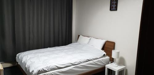 Postel nebo postele na pokoji v ubytování Bandal Book & Stay