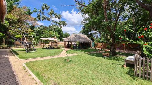 a garden with a gazebo and a playground at Casa Saimiri in Alter do Chao