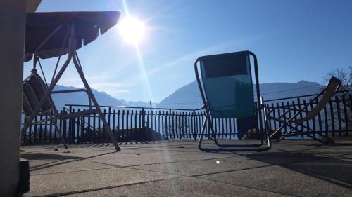 a tv sitting on top of a balcony with the sun at Casa vacanze Fregè in Castione Andevenno