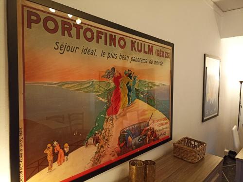 a large painting hanging on a wall at A due passi dal cielo e dal mare - Balcony with Sea View in Camogli