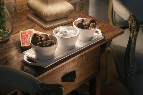 a table with three cups of food on it at Il Relais dell'Abbazia in Verona