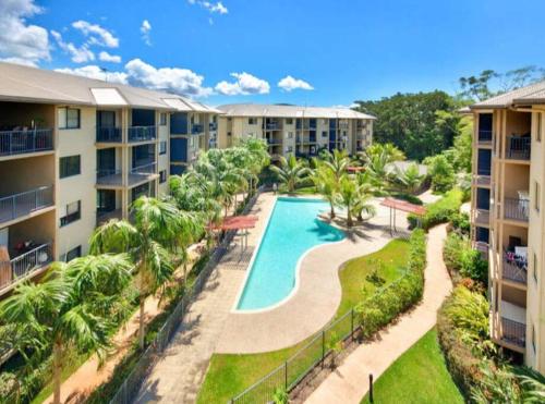 an aerial view of an apartment complex with a swimming pool at 3 bedroom 2 bath apartment in Cairns Queensland in Cairns