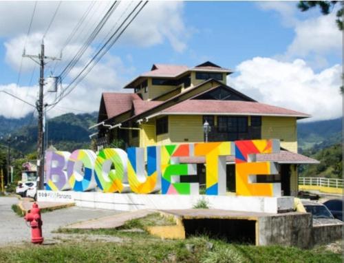 a house with a mural on the side of a wall at sweet Home alto Boquete in Tortuga