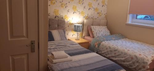 Ένα ή περισσότερα κρεβάτια σε δωμάτιο στο Delightful home stay - Double ensuiteroom.
