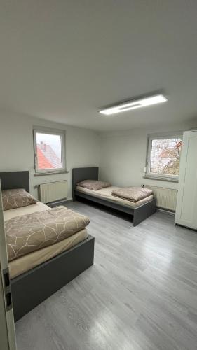Postel nebo postele na pokoji v ubytování Monteurzimmer Ringingen