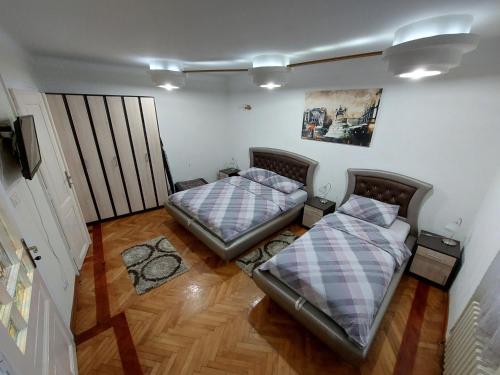 Llit o llits en una habitació de Bukoleon Apartment