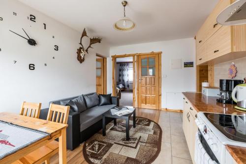 Kuchyň nebo kuchyňský kout v ubytování Apartamenty u Bacy