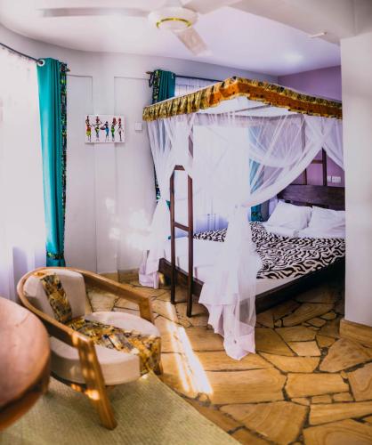 a bedroom with a bed with a canopy at Kilimanjaro Scenic Homestay in Moshi