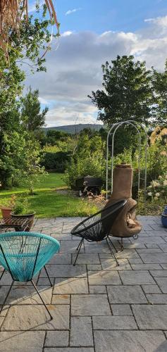 two chairs and a table on a patio at Rosemount in Sligo