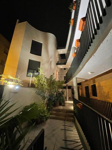 a hallway of a building at night at El Callejón del Molino in Lucena