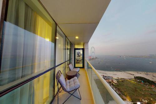 a balcony of a building with a view of the ocean at Palmar One Bedroom with Private Beach! in Dubai